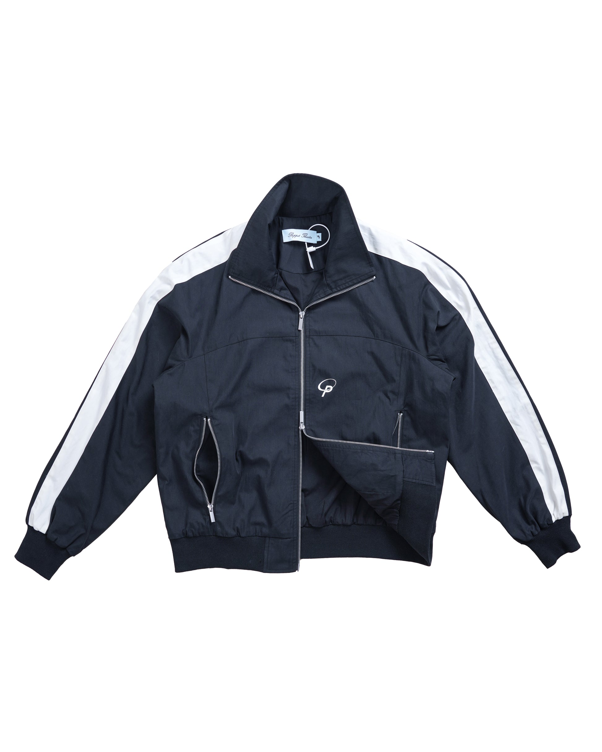 Flat lay of the Sports Top half-unzipped from the bottom — showcasing the functional two-way zipper and technical construction of this luxury athleisure jacket.