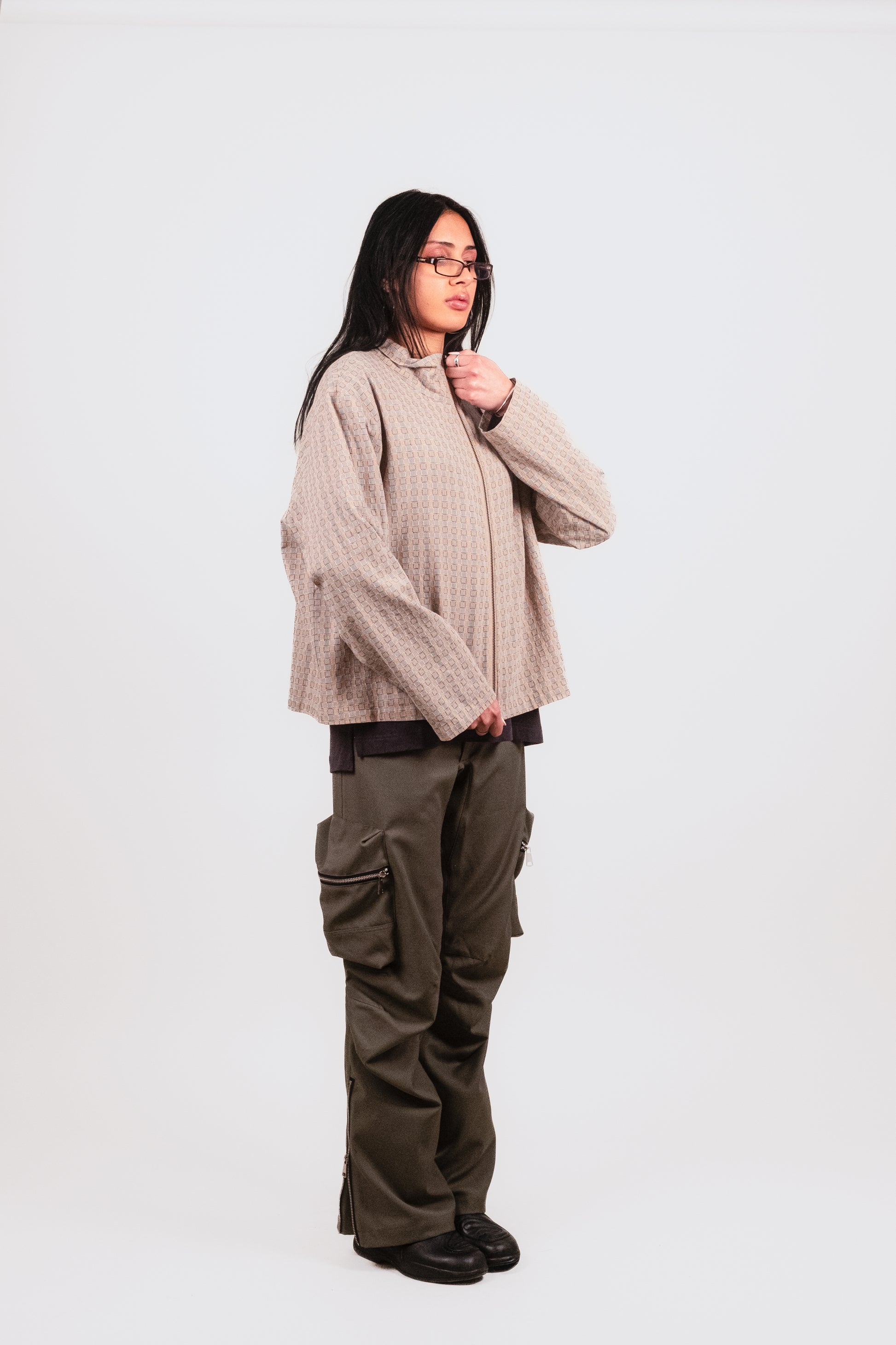 Anisa 1/4 angle in the Puppet Theater Smart Zip — refined pastel zip-up jacket with tailored drape and loose hemline, this zip up jacket is lightweight and perfect for the summer