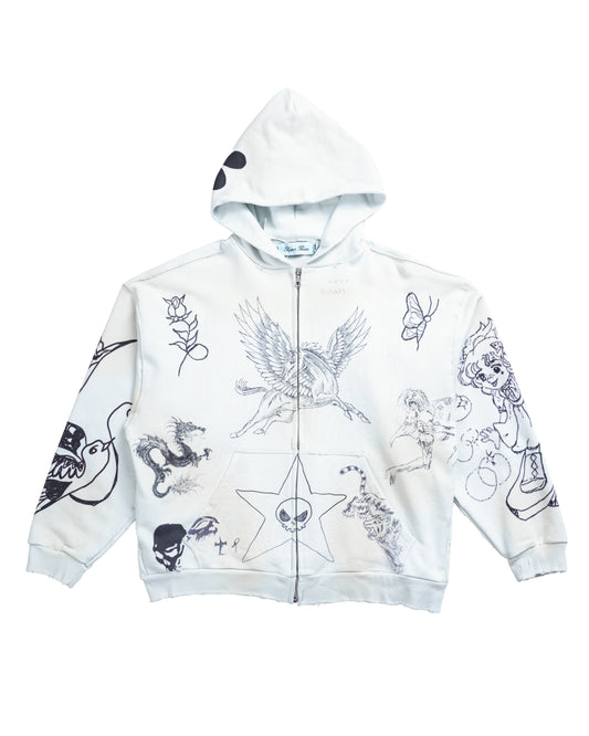 Flat lay front of the Second Skin Hoodie in Dove — a white zip-up hoodie in baby blue-washed heavyweight cotton French terry, covered in tattoo-inspired digital artwork and crafted with luxury streetwear precision.